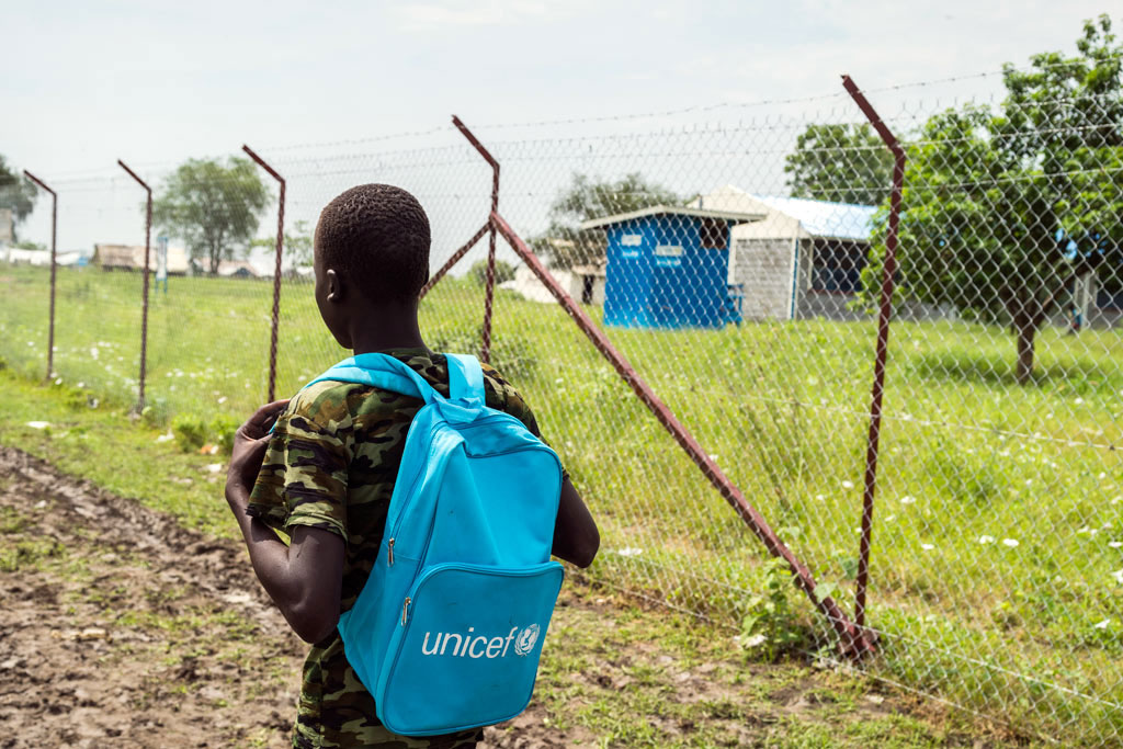 A 15-year-old boy, former child soldier on his way to school in a South Sudan town. (file) Photo: UNICEF/Ohanesian